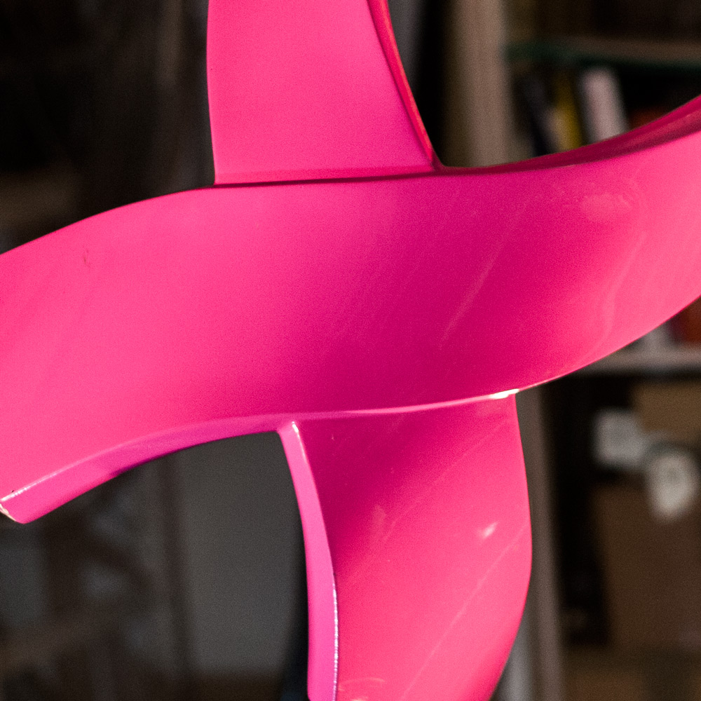A close-up of a very pink Ribbon stool