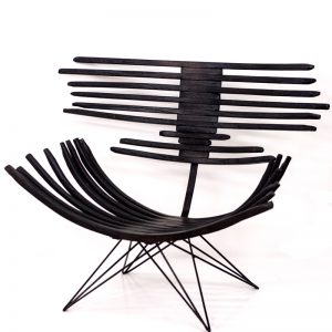 The dark and crispy Carbon chair contrasts strongly against a light background 