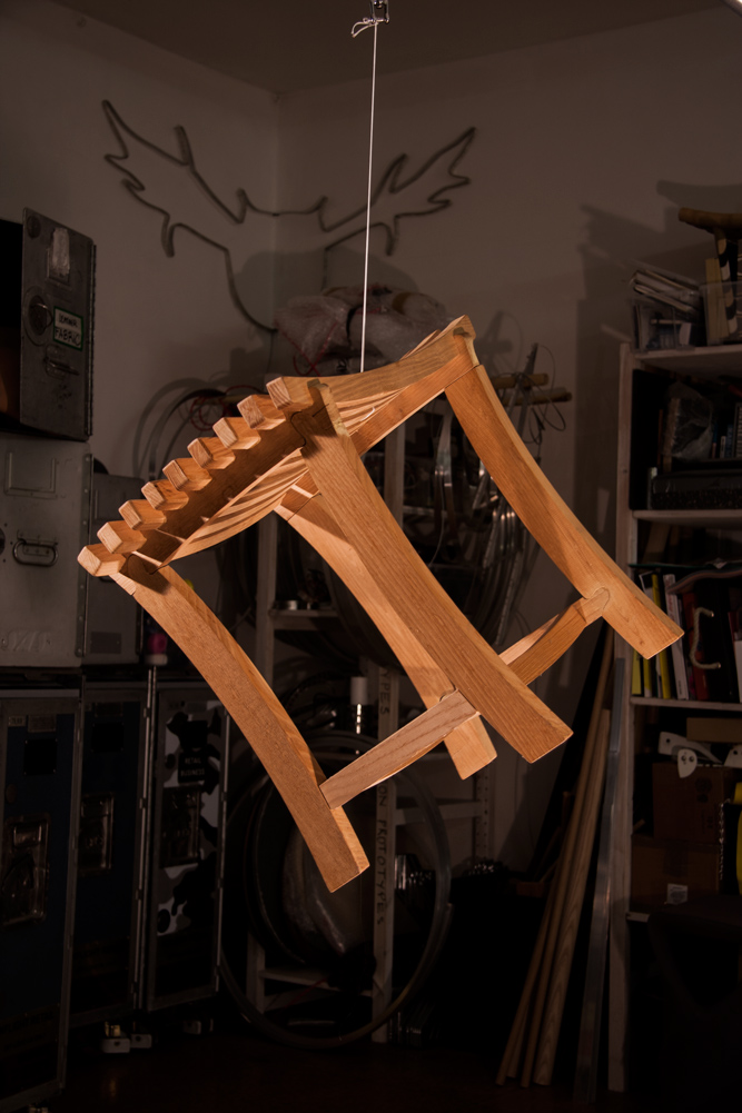 A Diddy stool suspended mid-air in a workshop, looking super-fly.