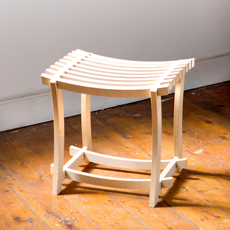 A Diddy stool in the natural light on a hardwood floor, looking fly.