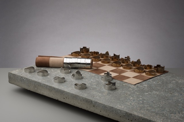 Rawstudio chess set shown with half of the leather board rolled, to demonstrate storage